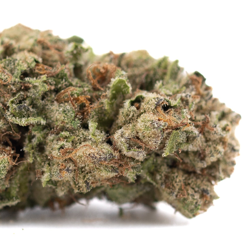 Candy Pave THCa hemp flower with green and brown hues covered in trichomes