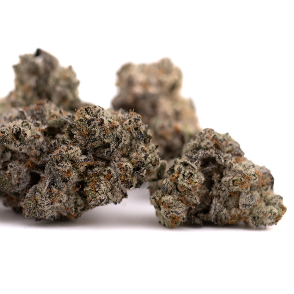 Dense cannabis buds of Fire OG THCa Indoor Flower, a premium THCA indoor hemp flower